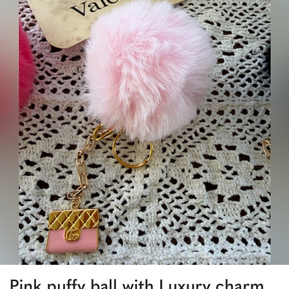 Pink puffy furry ball with luxury charm. Gold tone key ring or bag charm